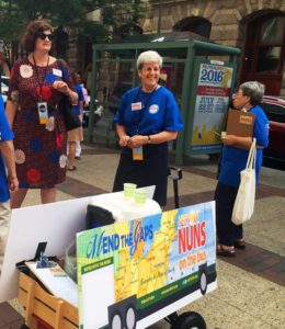 Catholic sisters volunteering with "Nuns on the Bus" offered lemonade and pledge cards to people walking near the intersection of 12th and Market streets in Philadelphia on July 29, 2016, during the Democratic National Convention. (Lynda Waddington/The Gazette)