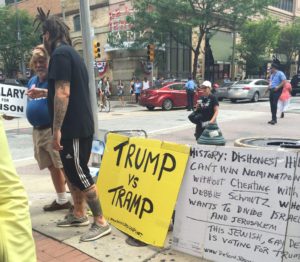A self-proclaimed "Jewish and gay" man labeled the 2016 election as "Trump vs. Tramp" at the Democratic National Convention in Philadelphia. He stood on the sidewalk just down the block from a Bernie Sanders rally where supporters heckled their candidate. (Lynda Waddington/The Gazette)