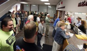 Long lines at the Johnson County Auditor's Office have historically been attributed to the first day of early voting, like this 2010 file photo depicts. On July 17, however, the Auditor's Office will begin accepting applications for Community ID cards. Johnson County is the first community in Iowa and in the Midwest to begin the practice. (Brian Ray/The Gazette)