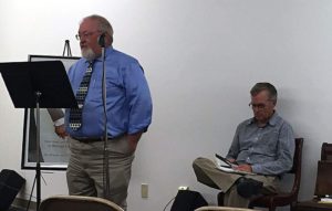 “Equal Before the Law” author Tom Witosky (left) reads a passage from the book for a group gathered in the lower level of Christ Episcopal Church in Cedar Rapids on Tuesday, June 23, 2015. Author Marc Hansen (seated) performed a reading later in the program. Both men signed copies of the book, which details Iowa’s larger influence in the national marriage equality debate, and visited with readers following the meeting. (Lynda Waddington/The Gazette)