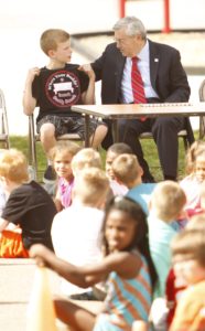 Isaac Taylor, a fifth-grader at Taylor Elementary School, talks with Gov. Terry Branstad at Arthur Elementary in Cedar Rapids this past Monday.