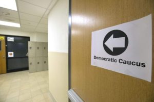 A sign points to an Iowa Democrats caucus location at Center Point-Urbana Middle School in Center Point on Monday, February 1, 2016.