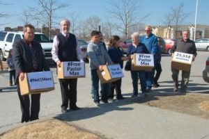 Friends and family of Iowa City Pastor Max Villatoro delivered boxes of signatures to Immigration and Customs Enforcement officials in Omaha, Neb. in hope the 41-year-old Honduras native will be considered for relief and not deported from the U.S. (Photo courtesy of Stan Harder)