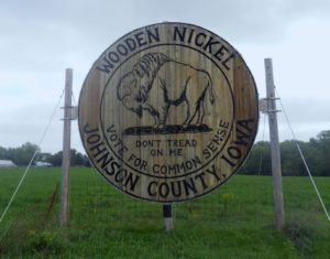 Located alongside Dubuque Street in Johnson County this wooden Nickel has stood in protest of local government since 2006, when county supervisors raised speed limits in the area. (Lynda Waddington/The Gazette) - Iowa Culture app