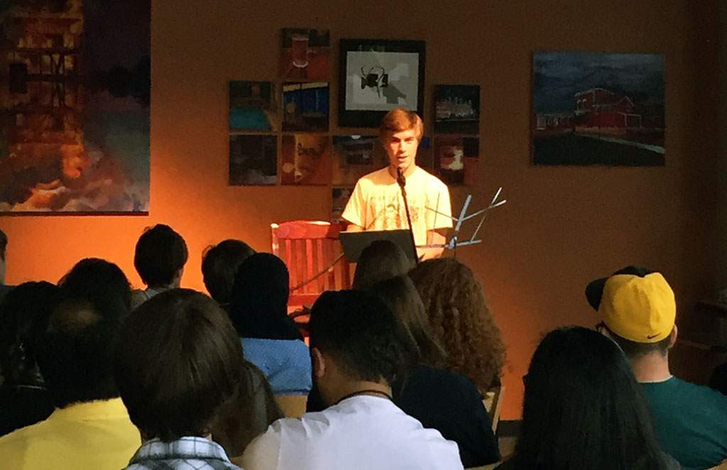 Young writer Scott Stevens is a rising senior from Atherton, Calif. He shared his original work as part of an open mic night at High Ground Cafe in Iowa City on June 24, 2015. Teens participating in the Iowa Young Writers’ Studio, Iowa Youth Writing Project or Between the Lines (international program) performed during open mic night as part of an opportunity to get to know each other better and share their work. (Lynda Waddington/The Gazette)