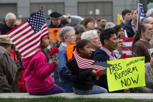 Participants gather May 10, 2013 outside of the federal courthouse for the Northern District of Iowa to participate in a remembrance and rally to mark the five-year anniversary of an immigration raid in Postville. (Brian Ray/The Gazette)