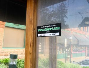 A sign promoting CR Transit is on the window of the sheltered bus stop at Marion Square on May 6, 2016. (Lynda Waddington/The Gazette)