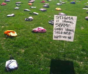 A sign is placed amid backpacks on a lawn at the University of Iowa in Iowa City to show the relationship between suicide and mental illness. News that suicides among young black males have more than doubled has served as the spark for a new community conversation in Cedar Rapids. Licensed social worker Linda Topinka is organizing the discussion, which will be held Thursday, June 18, at Jane Boyd. (File photo: Lauren Coffey/The Gazette)