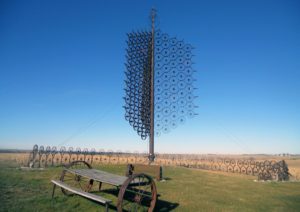This treelike sculpture made from more than 200 steel wagon wheels is located south of I-80, north of the town of Sully. It was created by Leonard J. Maasdam, an 87-year-old area sorghum farmer and inventor. (Lynda Waddington/The Gazette) - Iowa Culture