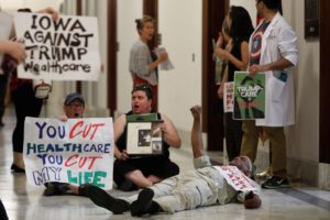 Healthcare activists are detained by Capitol Police after gathering to protest the Republican healthcare bill on Capitol Hill in Washington, U.S., July 19, 2017.
