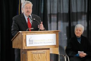 Openness - Gov. Terry Branstad speaks at an event with University of Iowa President Sally Mason, announcing a commitment by the UI Health Alliance to the Iowa Rural Physician Loan Repayment Program for medical student-debt forgiveness at the Medical Education and Research Facility 2013.Mason announced this past week that she hopes to retire, effective Aug. 1.