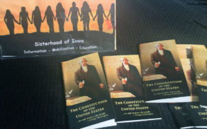 Four Iowa women founded the Sisterhood of Iowa last year shortly after the inauguration of President Donald Trump. They aim to better educate the public about the U.S. Constitution and have pooled personal funds to buy copies, which they give away. The copies shown here were distributed at the Women's March in Des Moines on Jan. 20, 2018.