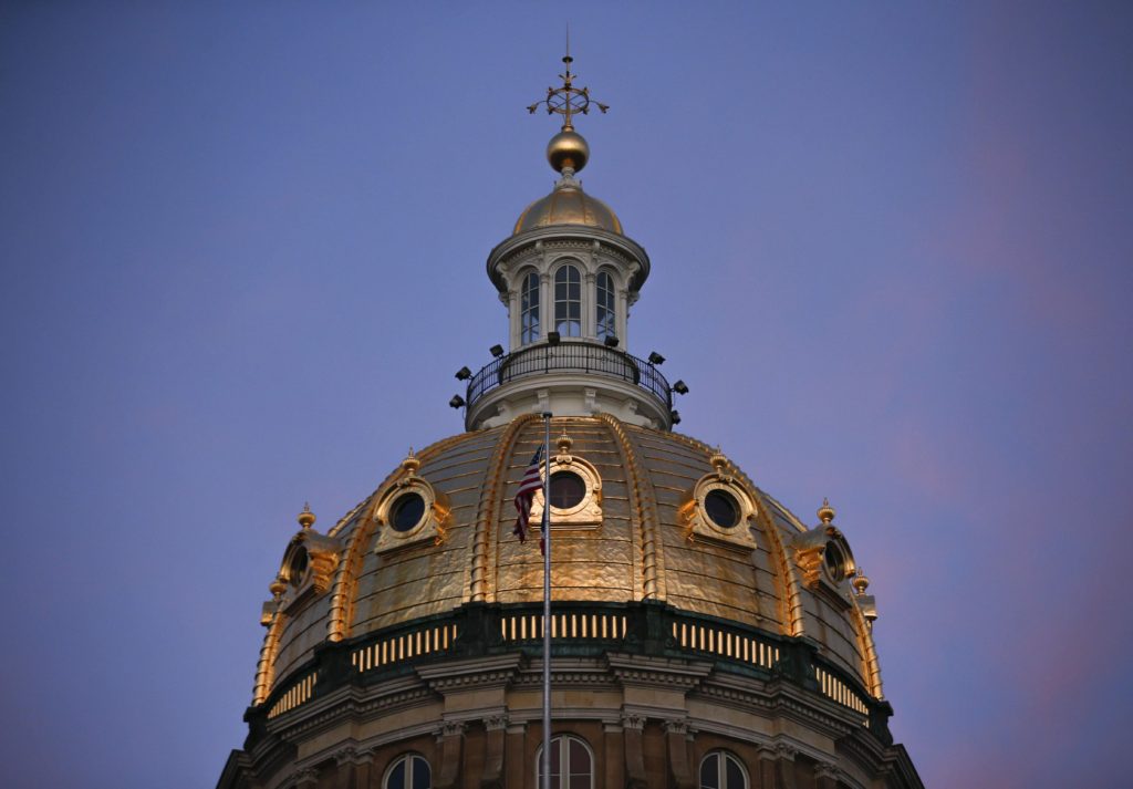 The State Capitol dome is illuminated by the sunset in Des Moines on Thursday, Feb. 16, 2017.
