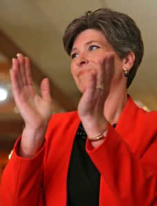 US Senate candidate Joni Ernst claps during an event at The Blue Strawberry Coffee Company in Cedar Rapids on Tuesday, September 30, 2014.