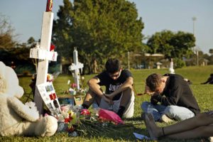 Gun violence - Students, friends and family gather at the memorial crosses at Pine Trails Park in Parkland, Fla., to remember those where were killed and injured in the shooting at Marjory Stoneman Douglas High School, on Friday, Feb. 16, 2018.