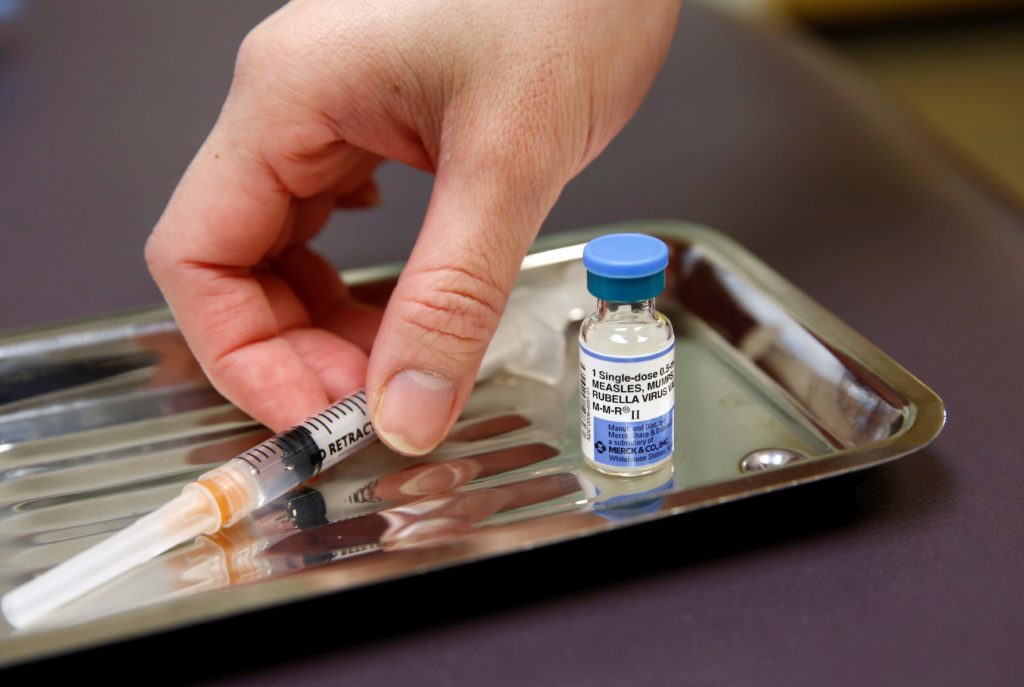 A vial of the measles, mumps, and rubella virus (MMR) vaccine is pictured at the International Community Health Services clinic in Seattle on March 20, 2019.